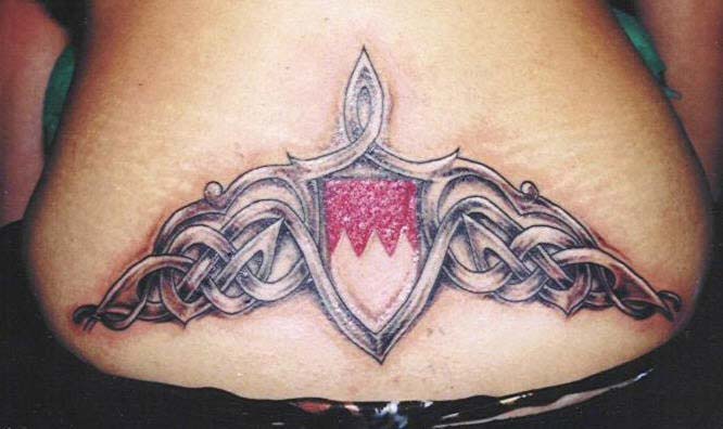 Heraldic shield with pattern tattoo in colour