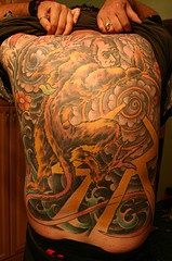 Manticore with amazing background large tattoo
