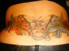 Butterfly with flowers coloured tattoo