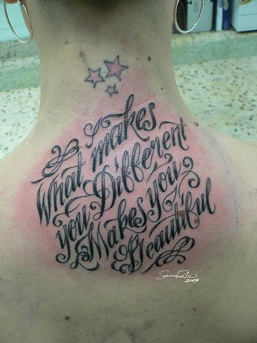 Back of neck tattoo with text