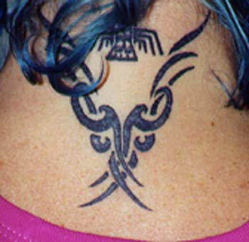 Tribal tracery tattoo on back of the neck