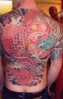 Large koi fish colourful tattoo