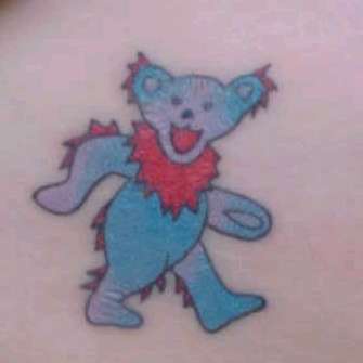 Walking blue bear tattoo