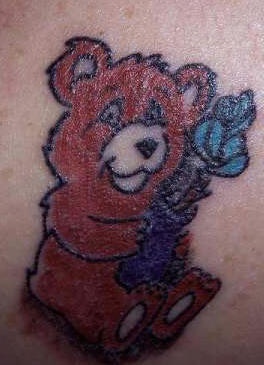 Cute bear present flower tattoo