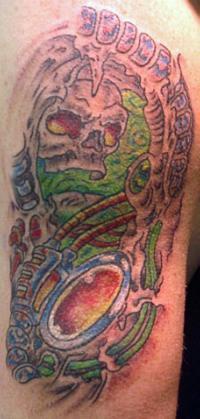 Biomechanical underworld coloured tattoo