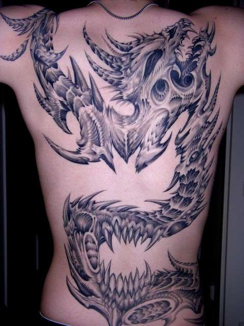 Biomechanical dragon tattoo on whole back