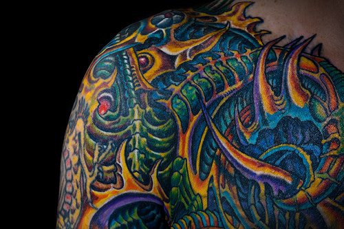Amazing coloured biomechanical tattoo