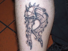 Biomech style letter r on arm
