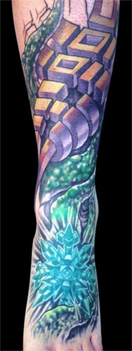 Surreal leg tattoo in colour