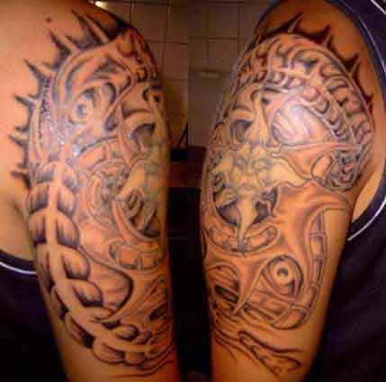 Biomechanical sun deity tattoo
