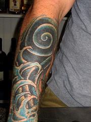 Biomech sea tattoo on arm