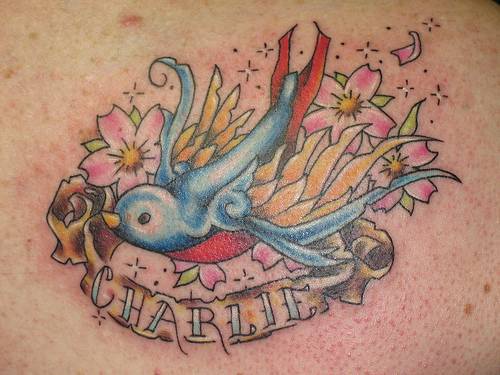 Charlie bird colourful tattoo
