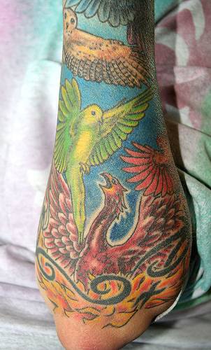 Colourful tattoo with many birds