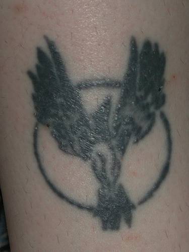 Mockingjay symbol tattoo