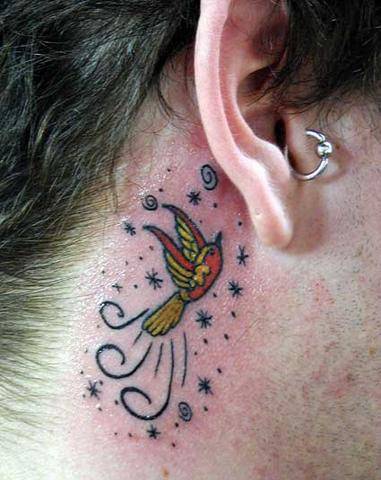 Firebird tattoo behind the ear
