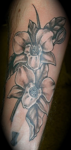 Black and white orchid flowers tattoo