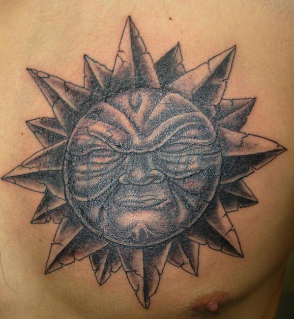 Black and white sun face tattoo