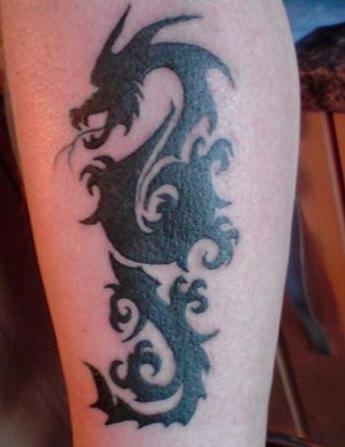 Black tribal dragon tattoo