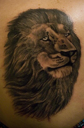 Black ink lion tattoo