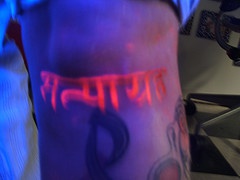 Hindu writings glowing tattoo