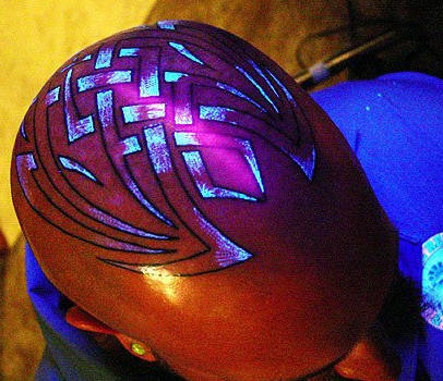 Glowing tracery head tattoo
