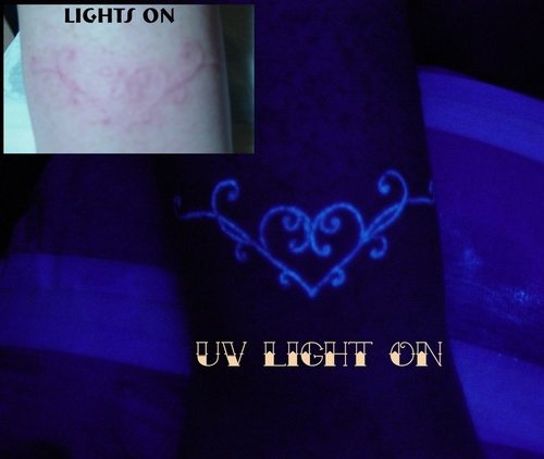 Heart tracery uv ink tattoo