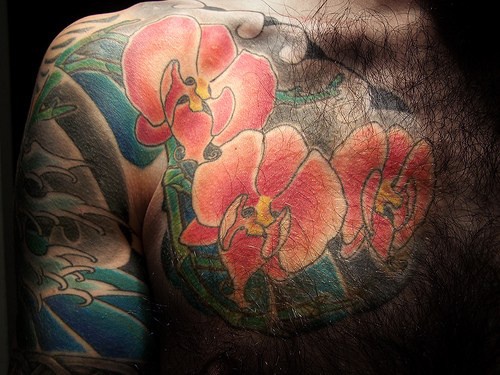 Red orchid flower tattoo on whole body