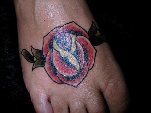 Red rose tattoo on foot