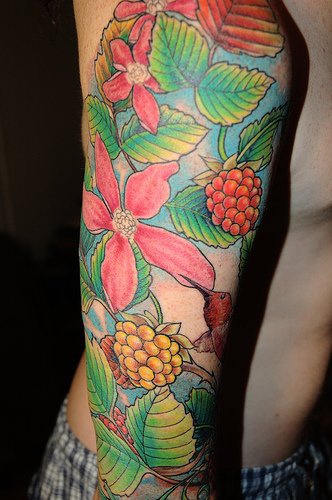 Lush colourful flowers sleeve tattoo