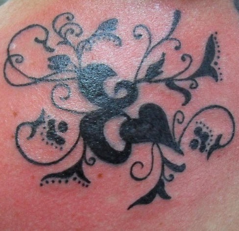 Flower pattern black ink tattoo