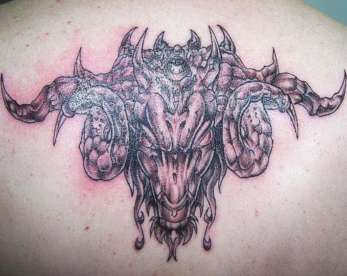 Occult goat tattoo on back