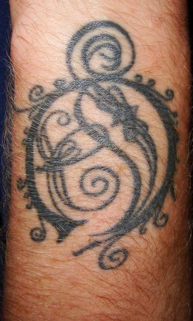 Black circle tracery tattoo