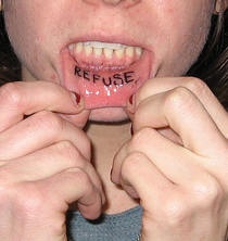 Bottom lip tattoo, refuse, big, black word