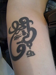 budda simbolo musicale tatuaggio