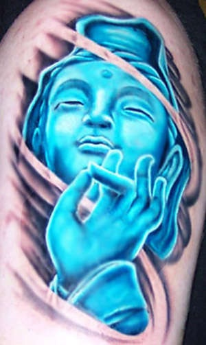Blue praying buddha tattoo