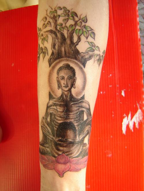 Starving buddha under tree tattoo