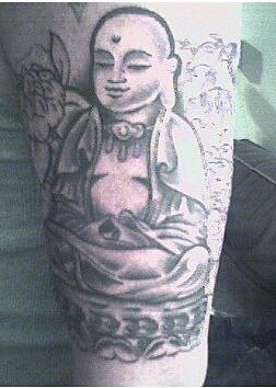 Peaceful bald buddha black ink tattoo