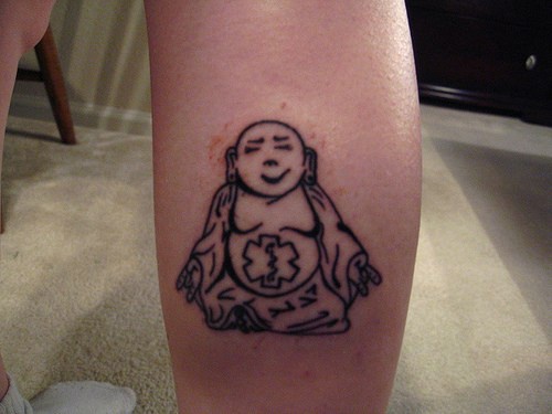 Glad buddha with belly tattoo