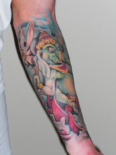 Ganesha colourful sleeve tattoo