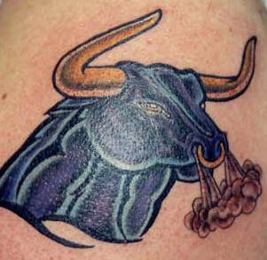 Dark blue angry bull tattoo