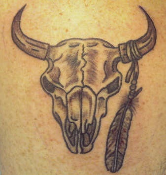 Bull skull with feather tattoo
