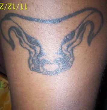 Strange bull head tattoo