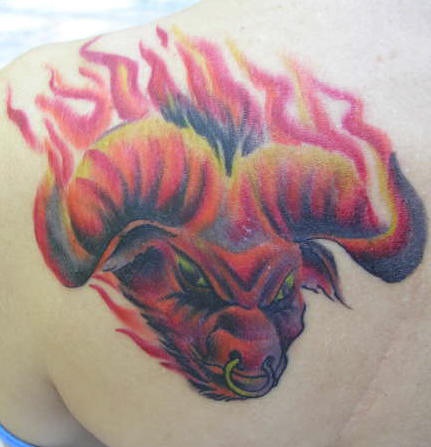 Diabolic bull in flames coloured tattoo