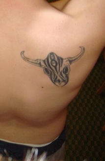 Bull head with tracery tattoo