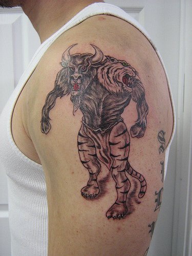 Angry minotaur tattoo on shoulder