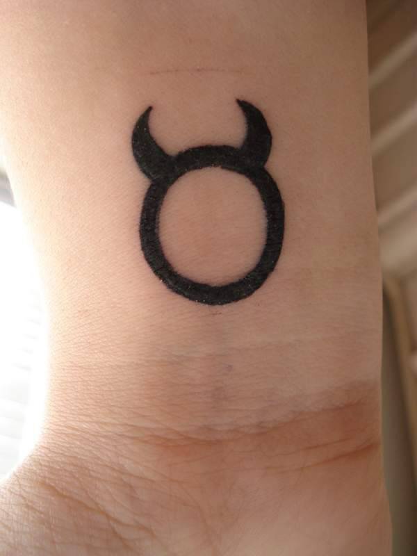 Bull symbol wrist tattoo