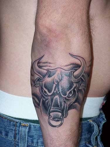 Angry bull black ink tattoo