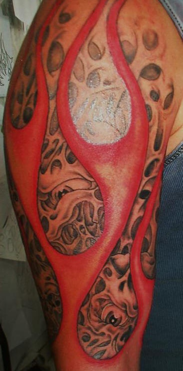 Flesh in red flame tattoo
