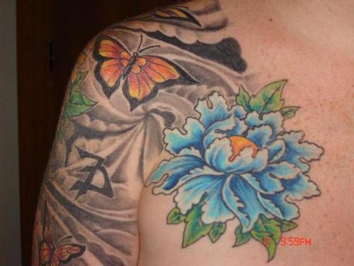 Butterfly and blue flower tattoo