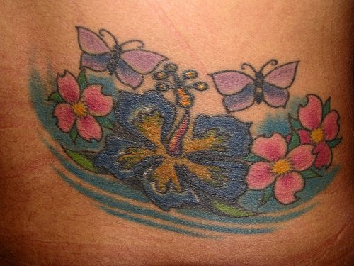 Lower back tattoo,big blue flowers, butterflies